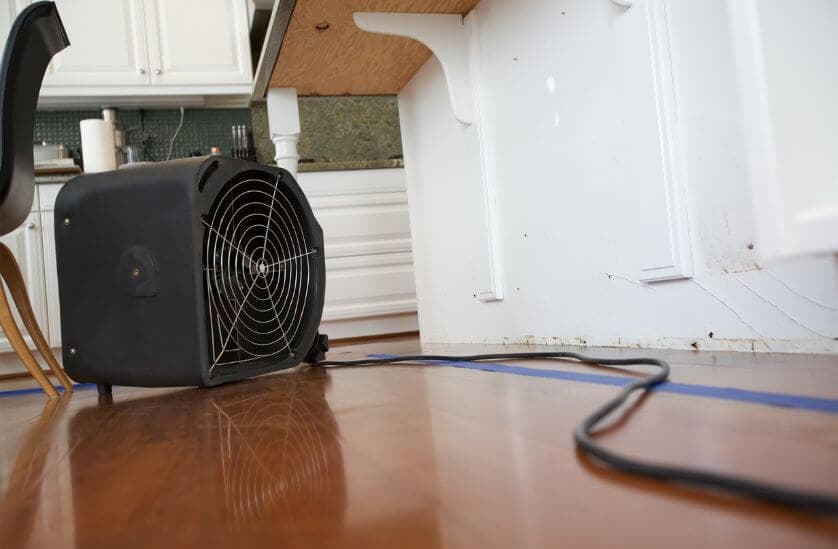 Air mover drying water damaged kitchen in Los Angeles