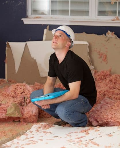 IICRC certified inspector assessing water damage